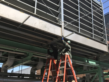 NEMSI employee providing mechanical services at the Danbury Fair Mall.